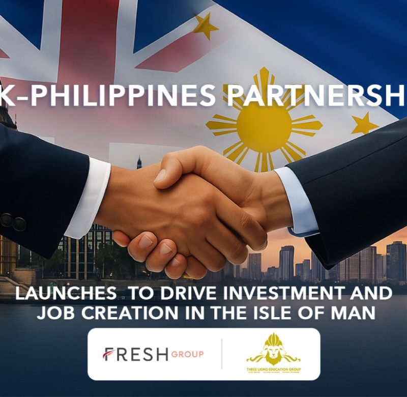 Professional handshake between two business people in suits against a backdrop featuring the UK Union Jack and Philippines flags, with London's Parliament buildings on the left and Manila's modern city skyline on the right. Text overlay reads 'UK-Philippines Partnership Launches to Drive Investment and Job Creation in the Isle of Man' with Fresh Group and Three Lions Education Group logos at the bottom.